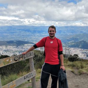 A Spanish student hiking at the Teleferico with a view of all of Quito
